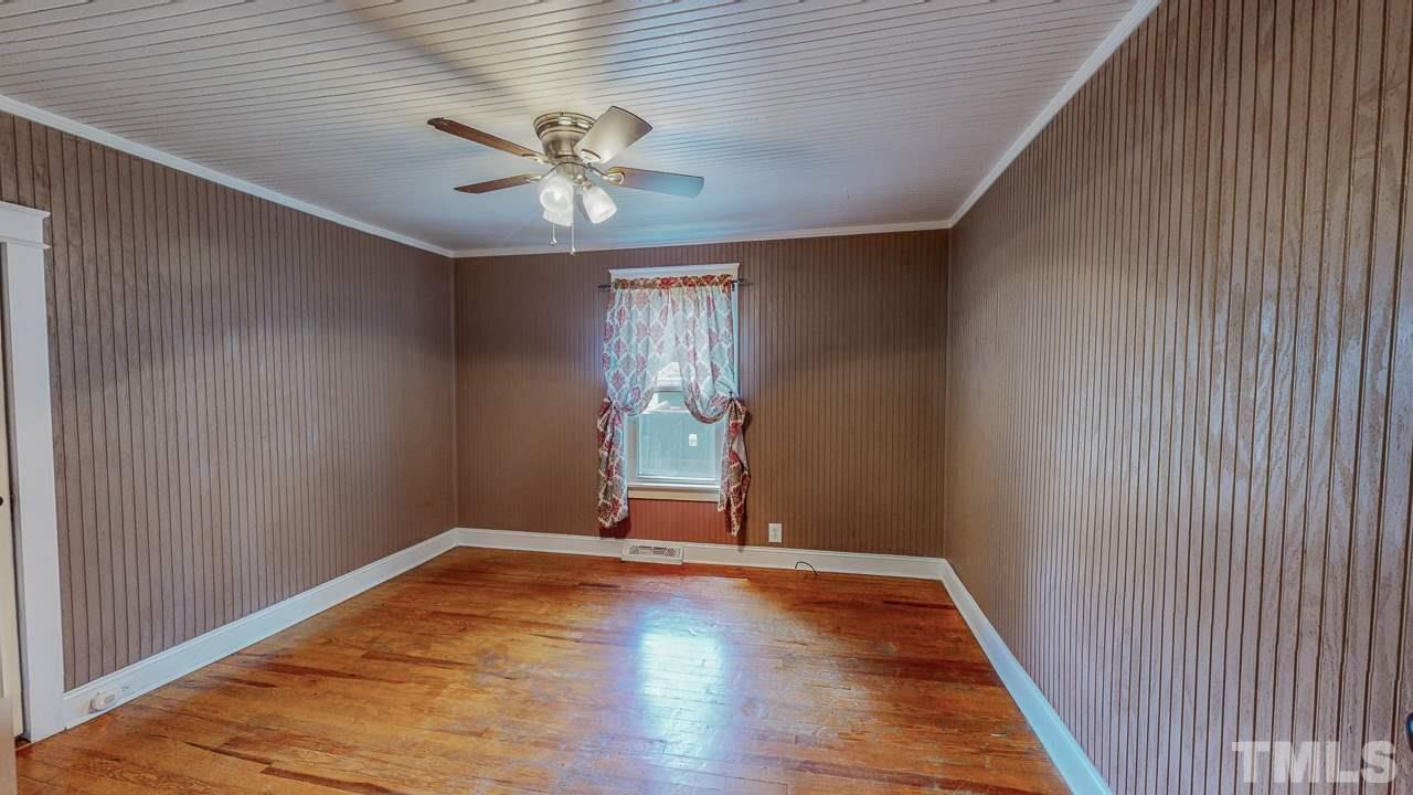 7089 Virgilina Road Roxboro, NC 27574 - Photo 15 of 28 a view of empty room with wooden floor