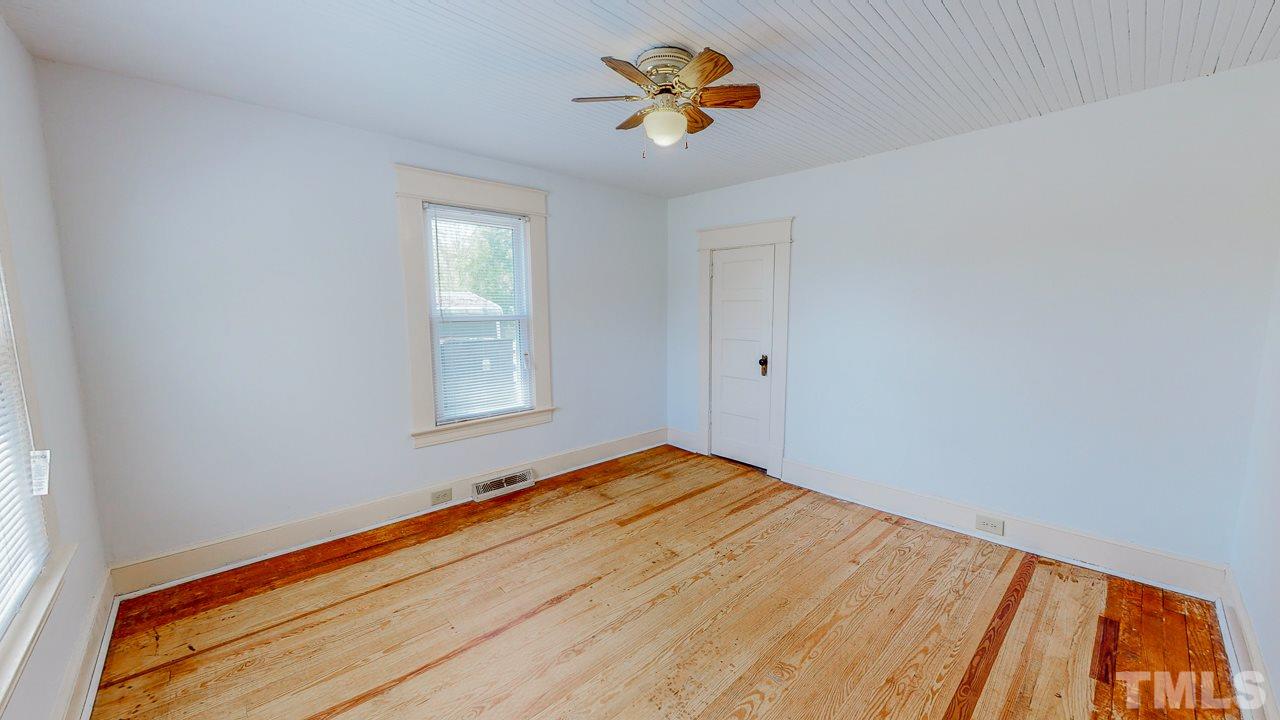 7089 Virgilina Road Roxboro, NC 27574 - Photo 16 of 28 a view of an empty room with a window