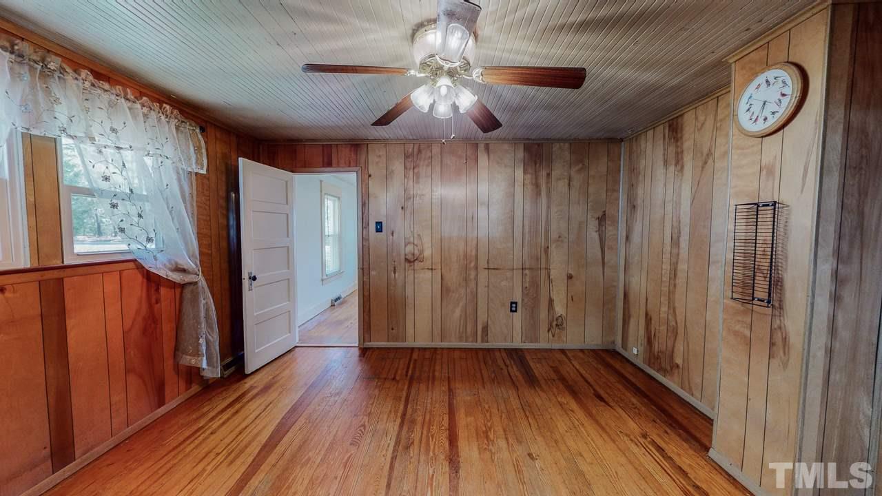 7089 Virgilina Road Roxboro, NC 27574 - Photo 20 of 28 a view of a hallway with wooden floor
