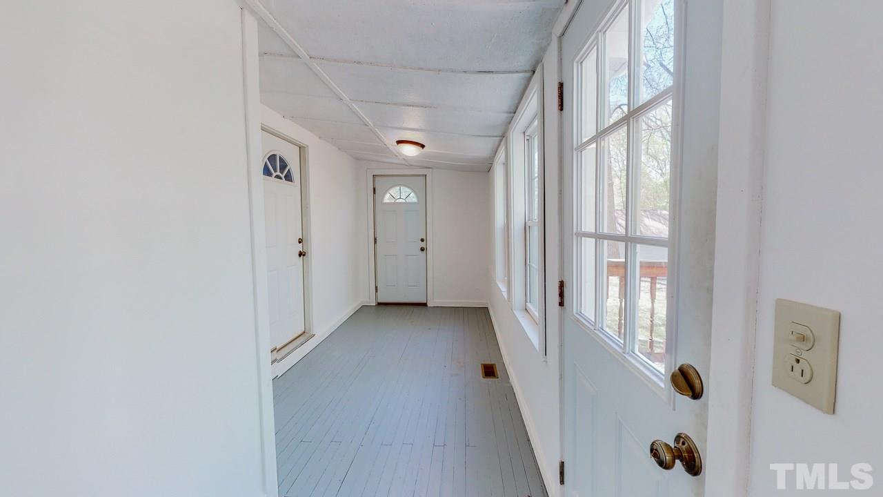 7089 Virgilina Road Roxboro, NC 27574 - Photo 23 of 28 a view of a hallway with windows