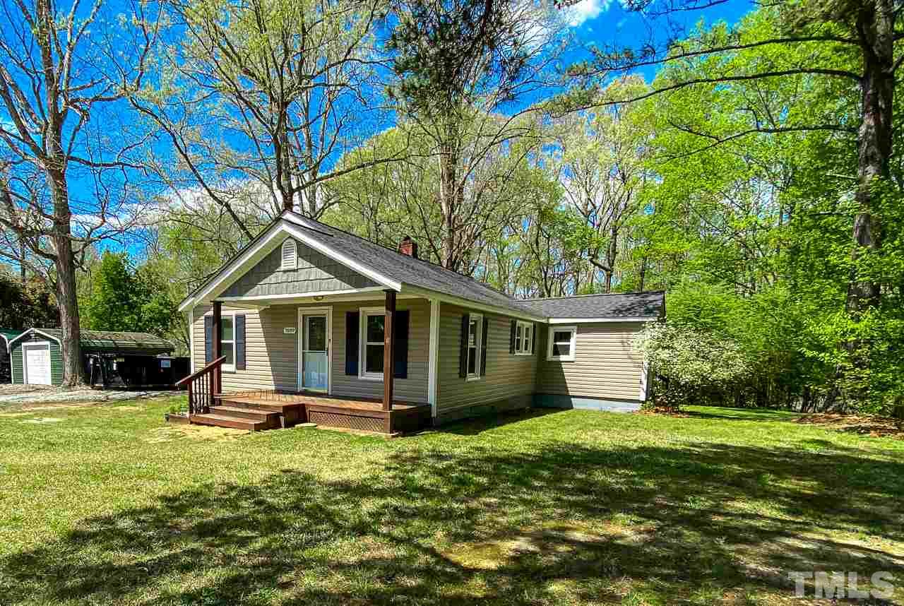 7089 Virgilina Road Roxboro, NC 27574 - Photo 25 of 28 a front view of a house with a yard