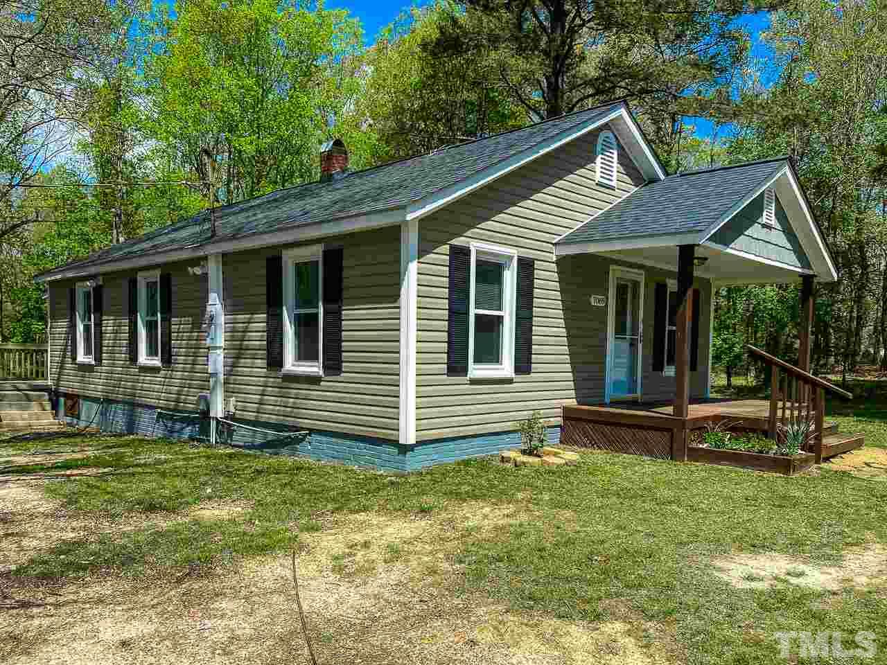 7089 Virgilina Road Roxboro, NC 27574 - Photo 26 of 28 a view of a house with backyard and wooden fence