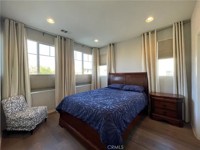 a bedroom with a bed and a walk in closet