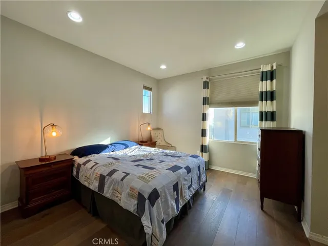 a bedroom with a bed and a walk in closet