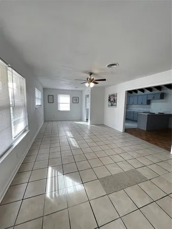 a view of a livingroom with a furniture and a ceiling fan