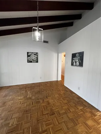 a kitchen with stainless steel appliances granite countertop a sink dishwasher a stove and a refrigerator