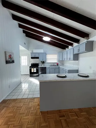 a view of an empty room with windows