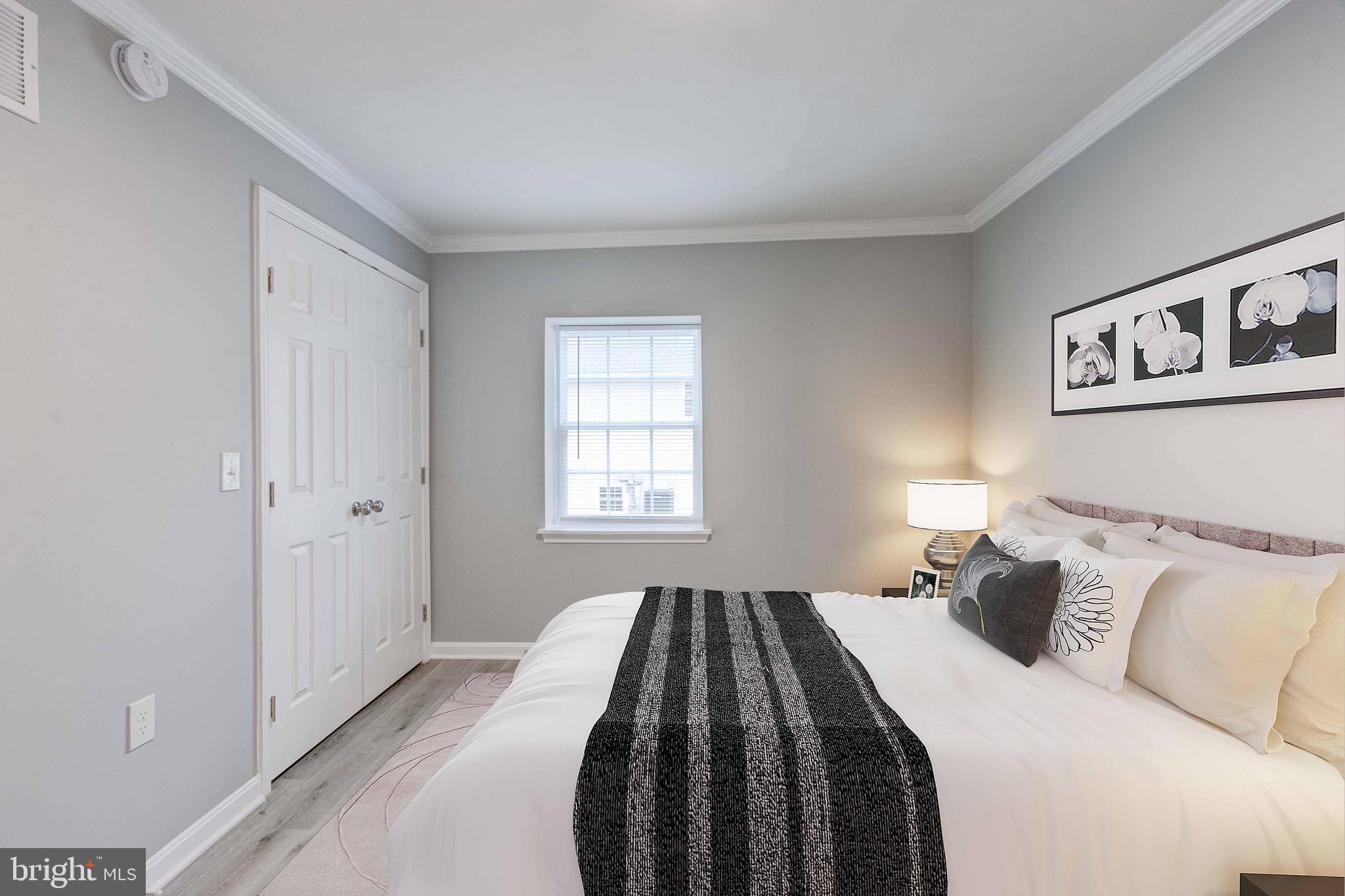 8149 Hog Neck Road Pasadena, MD 21122 - Photo 17 of 24 a bedroom with a bed and a window