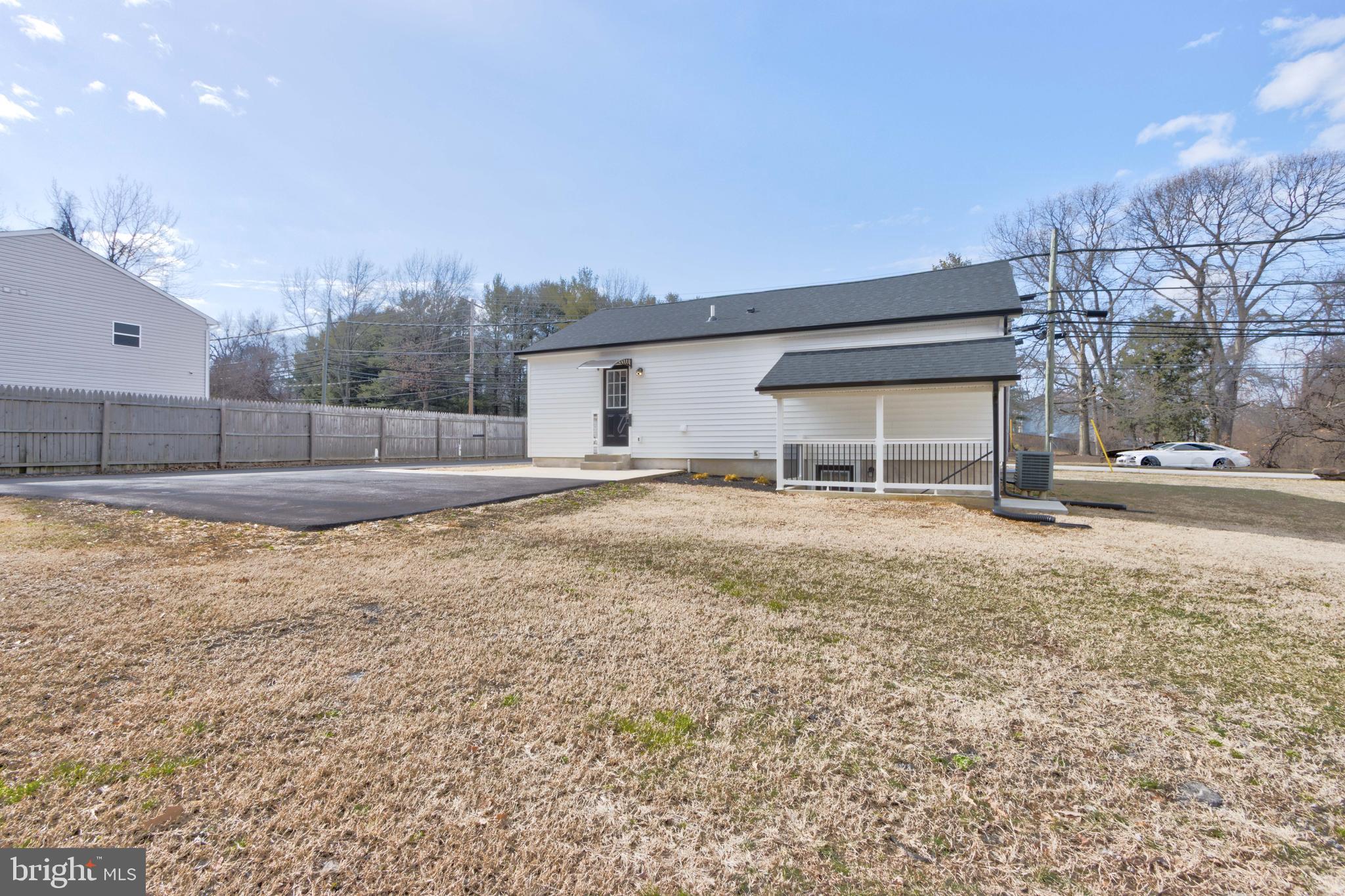 8149 Hog Neck Road Pasadena, MD 21122 - Photo 4 of 24 a view of a house with a yard
