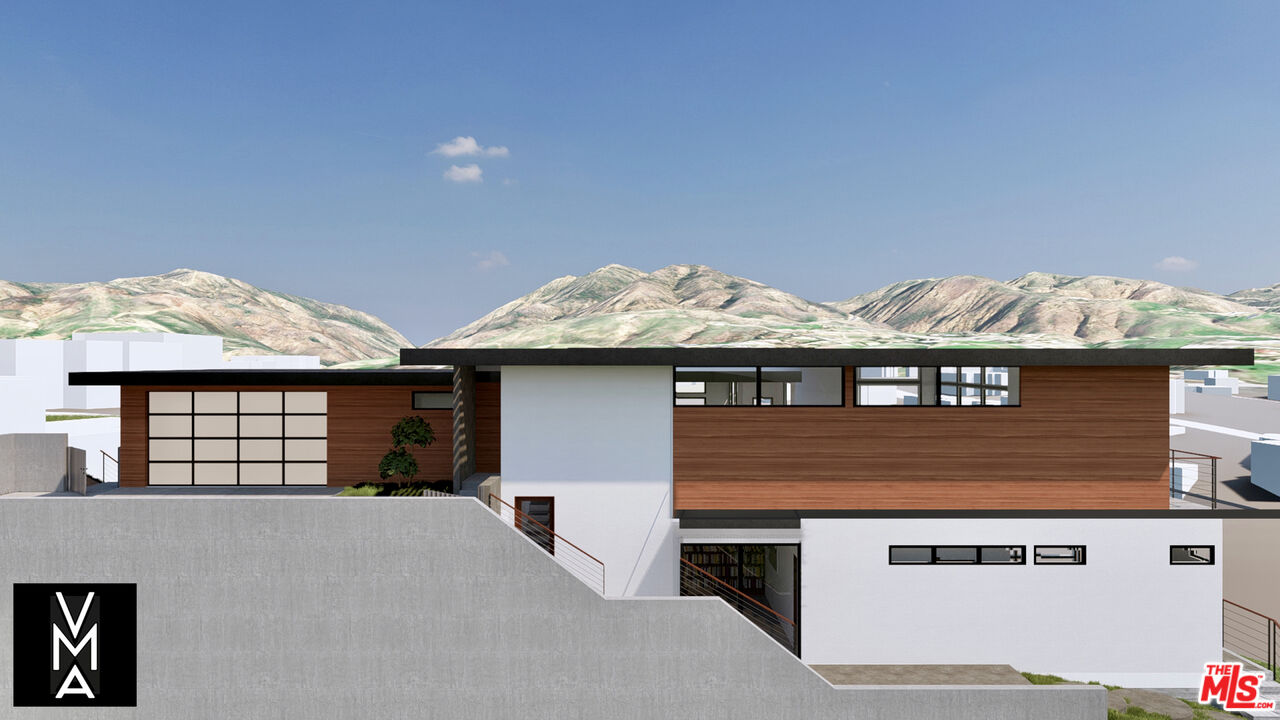 6756 Dume Drive Malibu, CA 90265 - Photo 5 of 17 a front view of a house with mountain