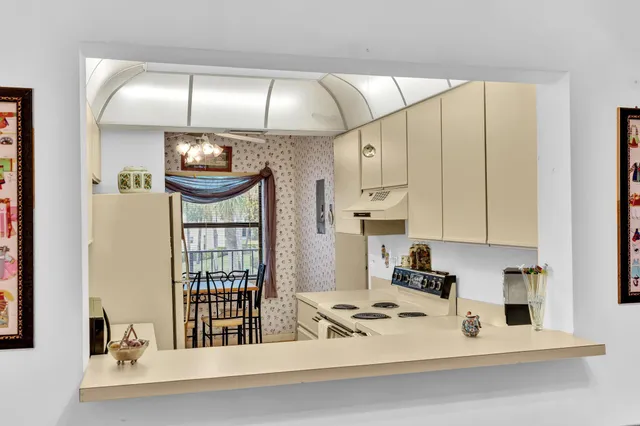 an aerial view of a house with garden space and street view