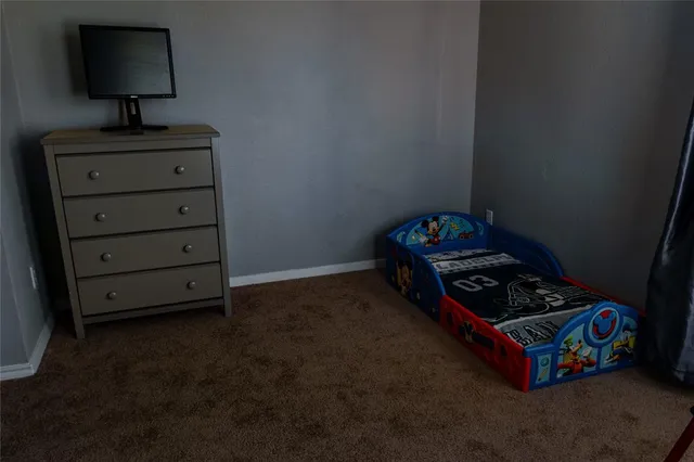 a room with toys and a lamp on table