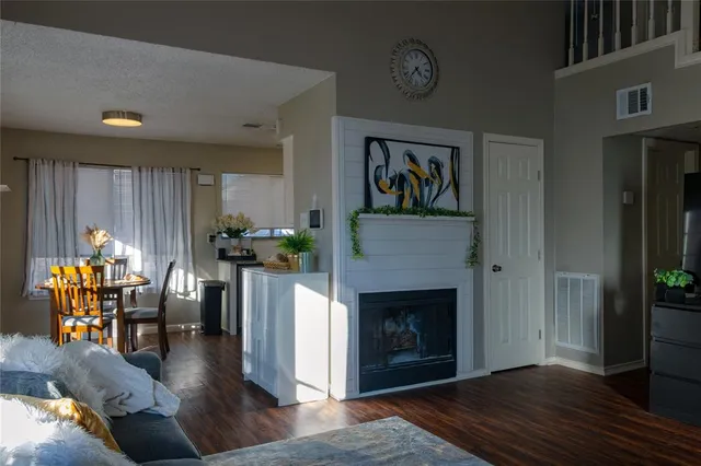 a living room with furniture fireplace and window