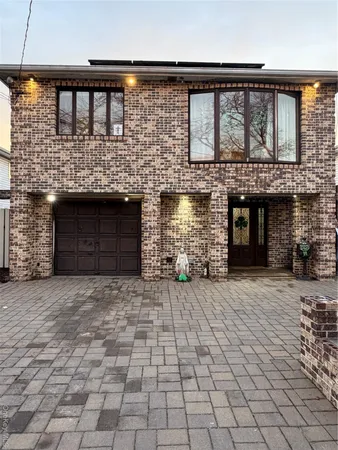 a front view of a house with yard