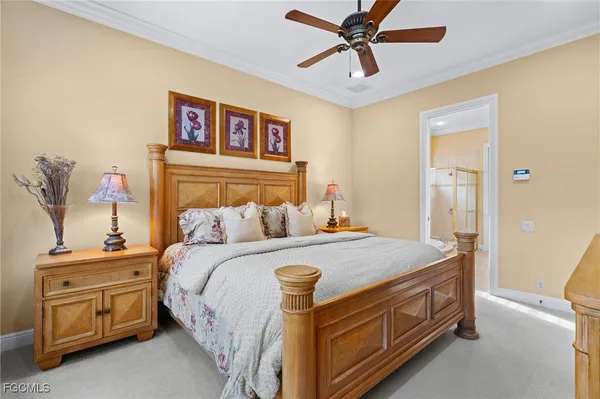 a bed room with a bed and a chandelier