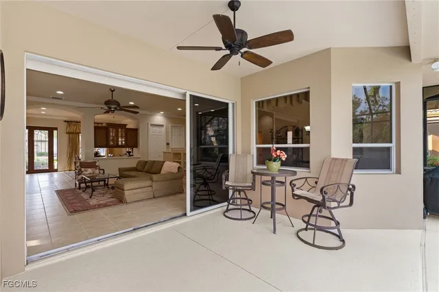 a view of a livingroom with furniture and a ceiling fan