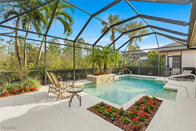 a view of a backyard with sitting area