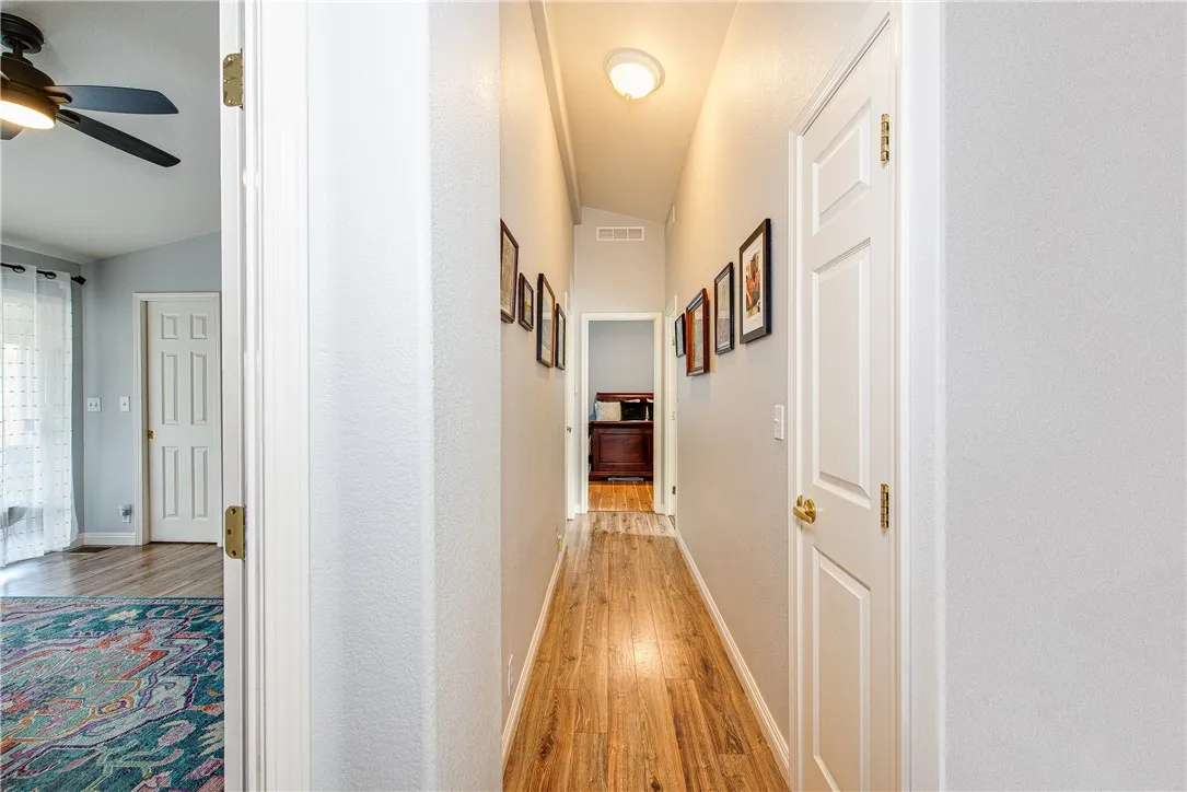 27250 Murrieta Road, Unit 304 Menifee, CA 92586 - Photo 5 of 29 a view of a hallway with wooden floor and entryway