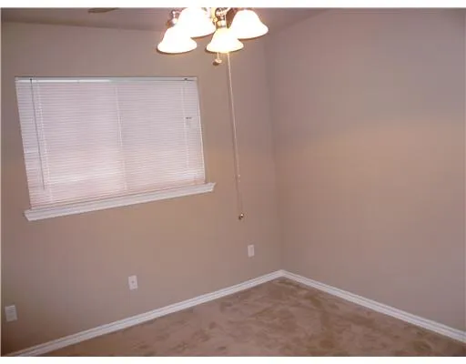 a view of a small space with fan