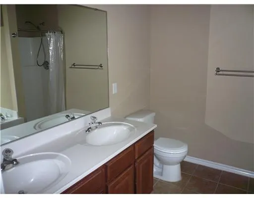 a bathroom with a sink toilet and vanity