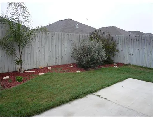 a view of a backyard with a garden