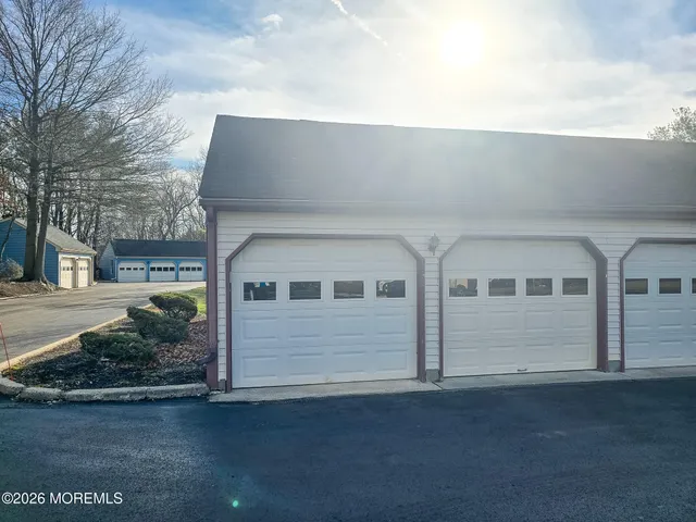 a view of a kitchen with a sink and a refrigerator