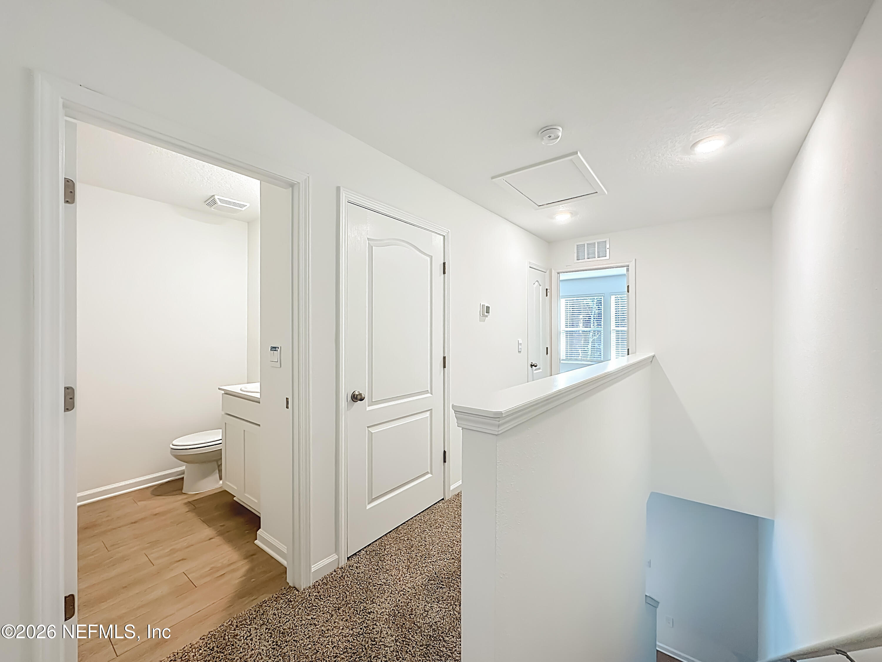 199 Palmetto Rdg Road St. Augustine, FL 32095 - Photo 6 of 11 a view of a hallway with bathroom and a sink