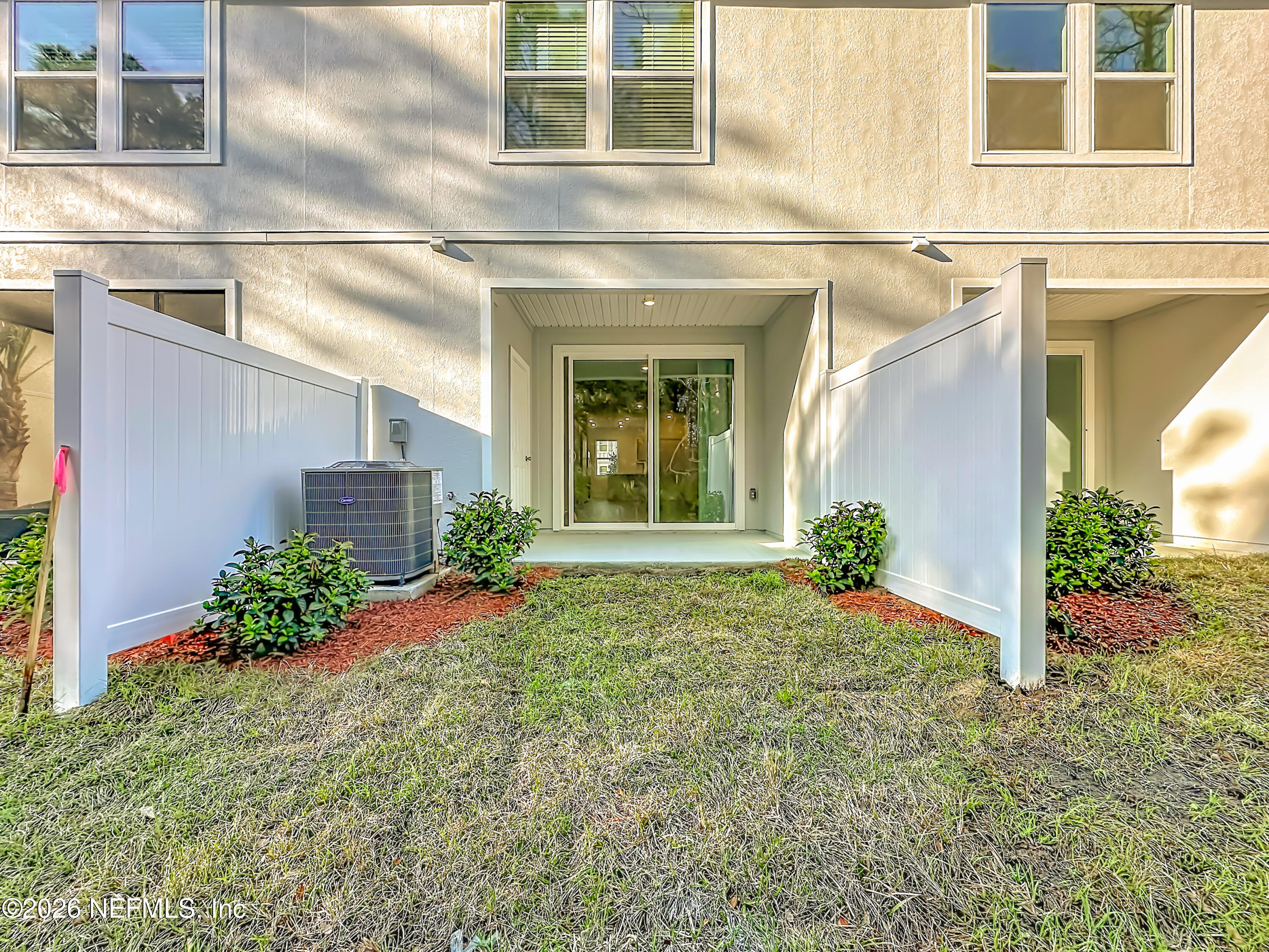 199 Palmetto Rdg Road St. Augustine, FL 32095 - Photo 10 of 11 a view of a house with potted plants