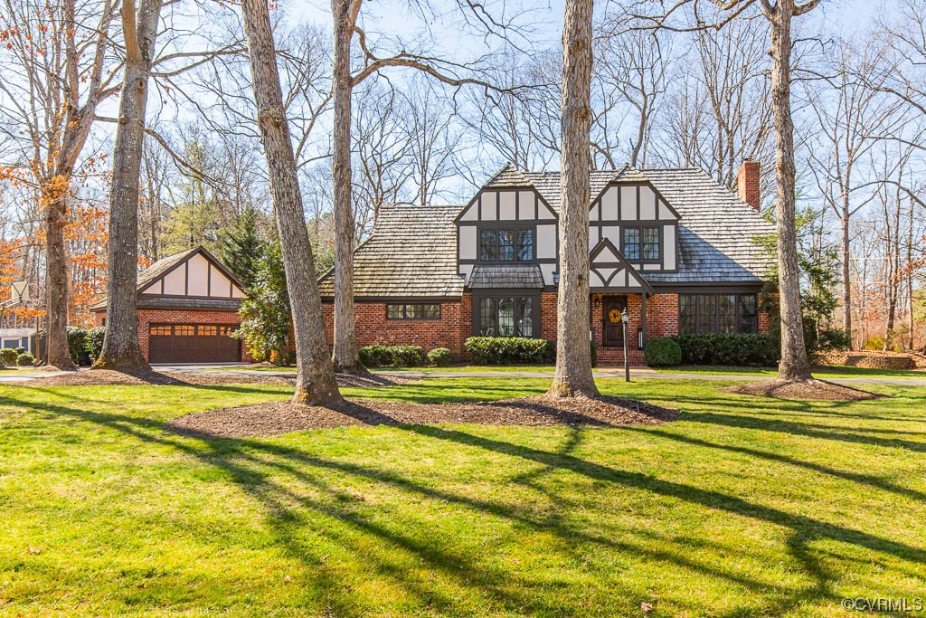 2340 Banstead Road Midlothian, VA 23113 - Photo 1 of 1 a front view of a house with a yard and large trees