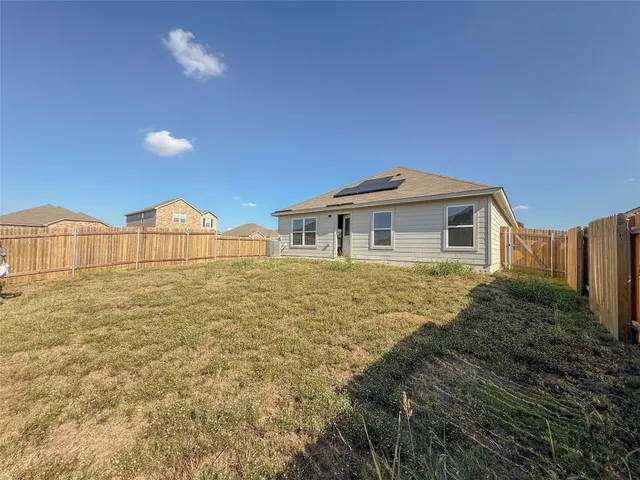 a big house with swimming pool in front of it