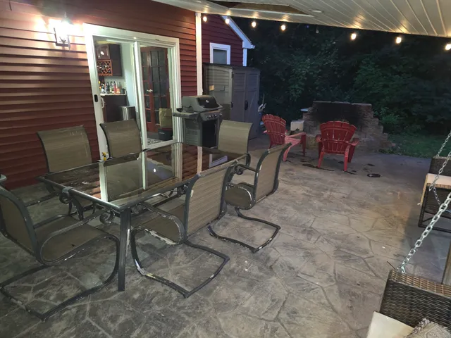 a view of a backyard with wooden fence