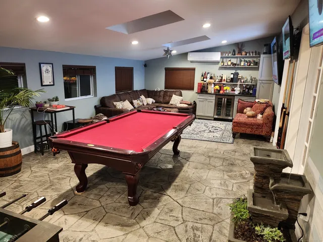 a kitchen with center island table and chairs in it