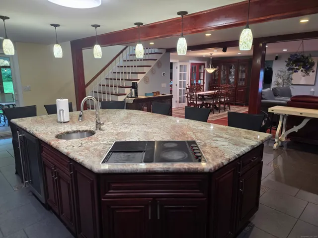 a kitchen with sink and cabinets