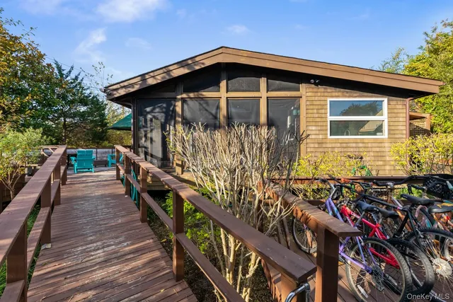 a front view of a house with wooden stairs