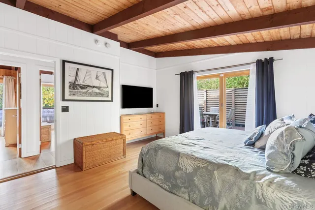 a bathroom with a sink toilet a mirror and shower