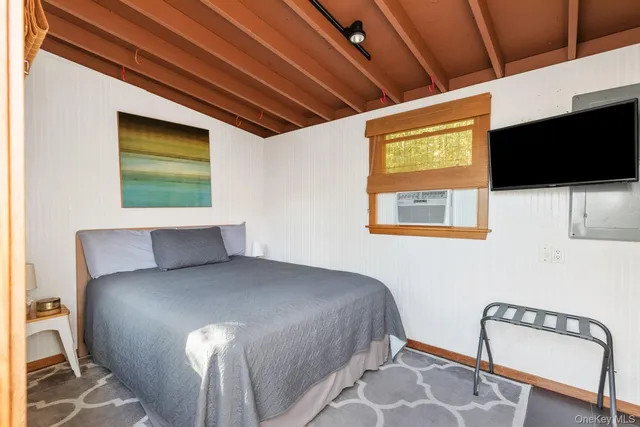 a bathroom with a bathtub and shower