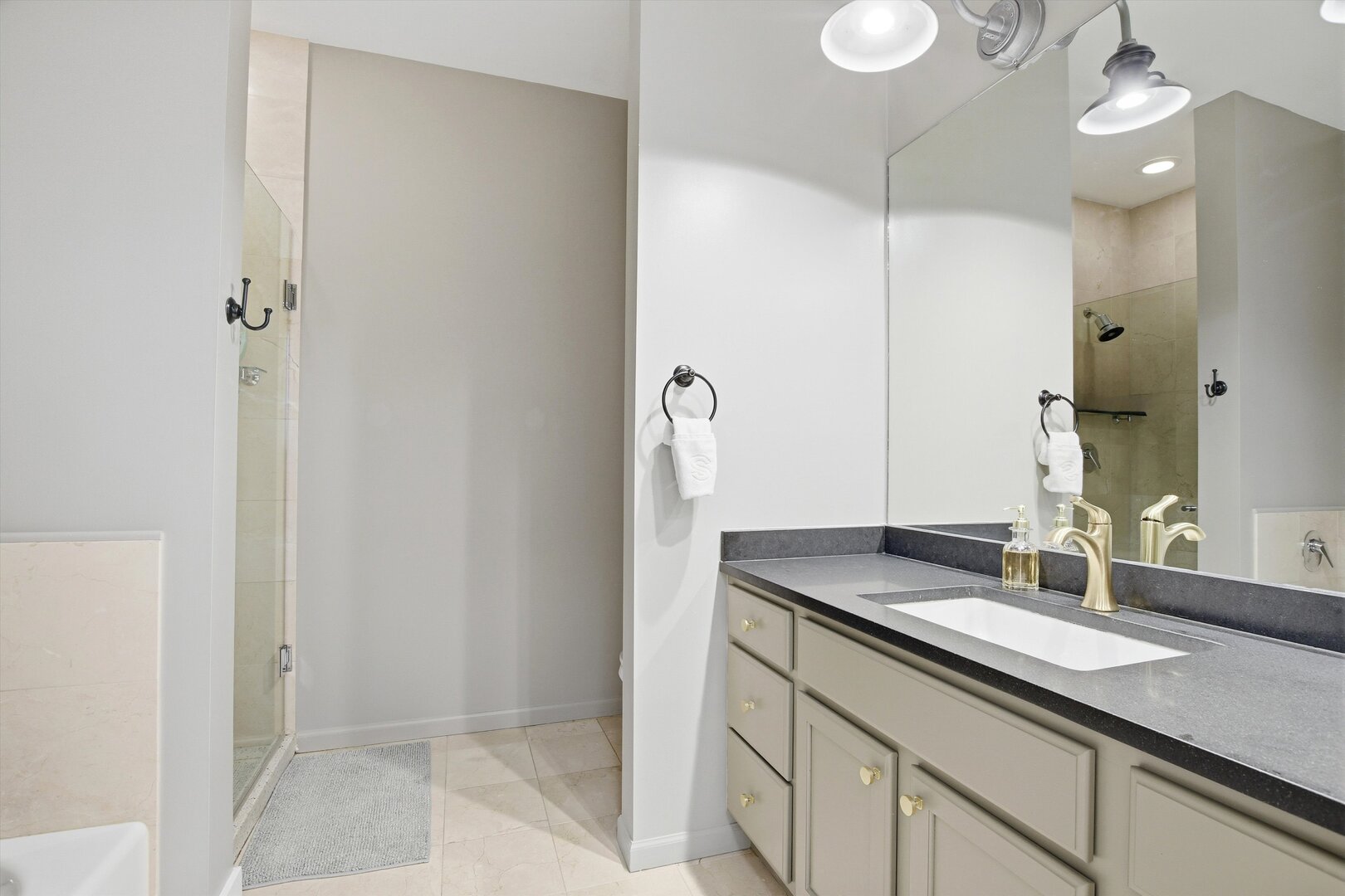 1235 West George Street, Unit 103 Chicago, IL 60657 - Photo 14 of 28 a bathroom with a sink and a mirror