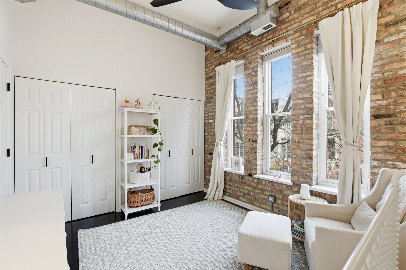 1235 West George Street, Unit 103 Chicago, IL 60657 - Photo 18 of 28 a living room with furniture and a large window