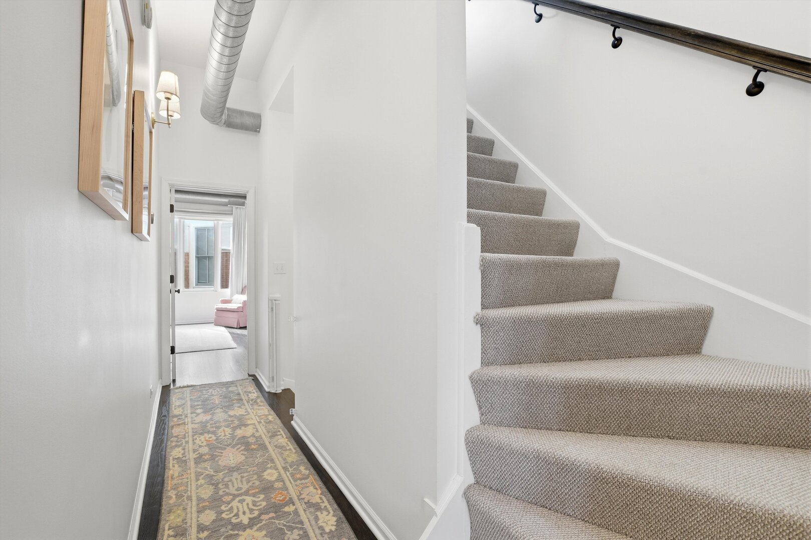 1235 West George Street, Unit 103 Chicago, IL 60657 - Photo 20 of 28 a view of entryway and hall with wooden floor