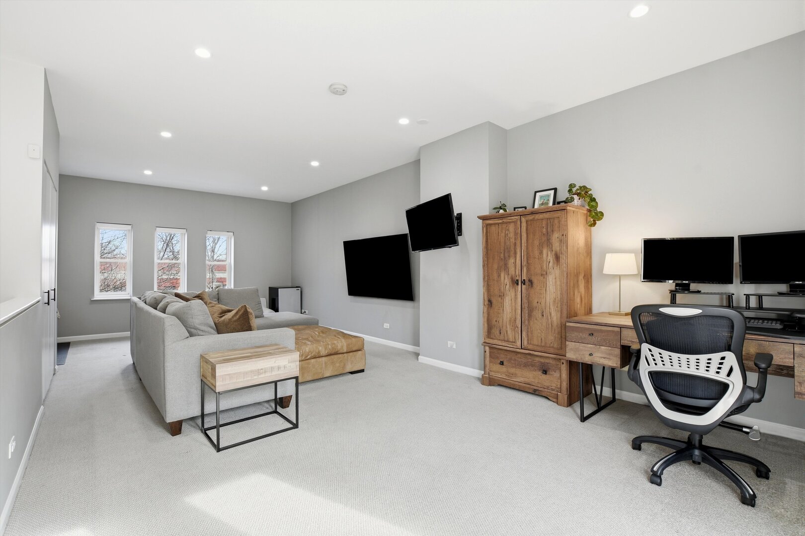 1235 West George Street, Unit 103 Chicago, IL 60657 - Photo 21 of 28 a living room with furniture and a flat screen tv