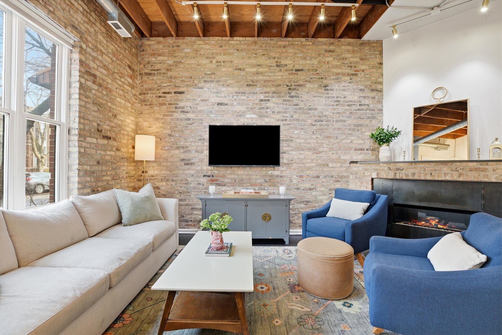 1235 West George Street, Unit 103 Chicago, IL 60657 - Photo 3 of 28 a living room with furniture and a fireplace