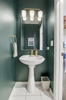 a bathroom with a sink and mirror