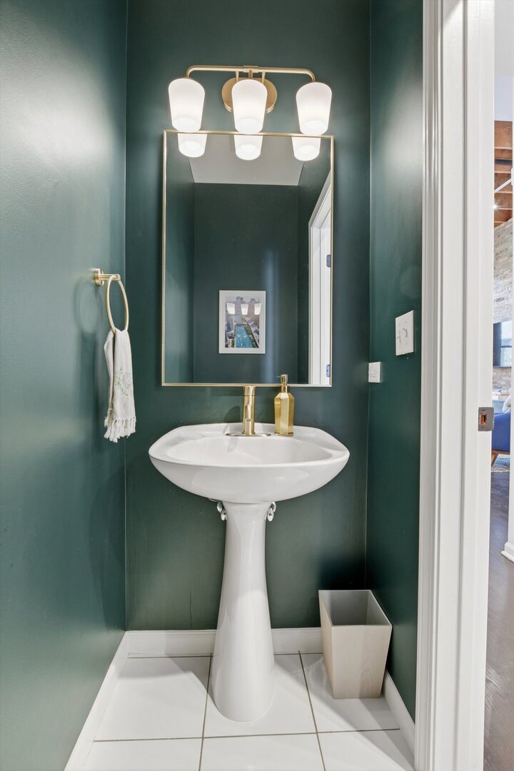 1235 West George Street, Unit 103 Chicago, IL 60657 - Photo 9 of 28 a bathroom with a sink and mirror