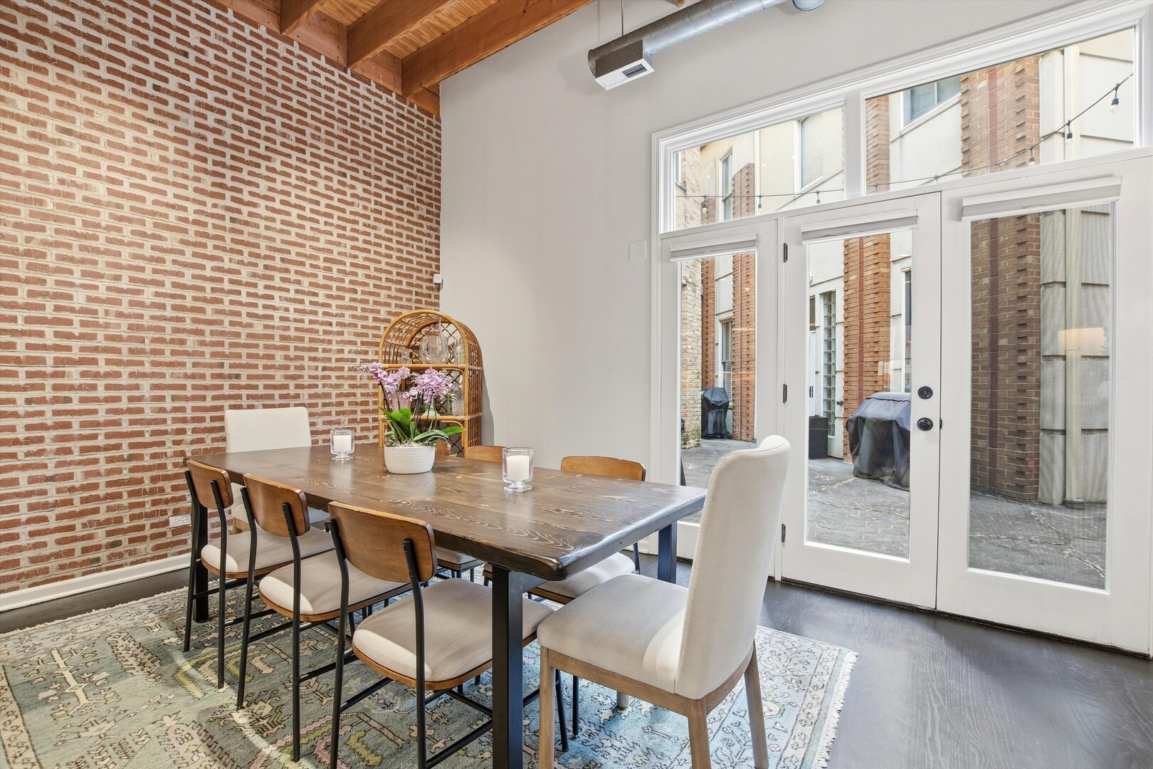 1235 West George Street, Unit 103 Chicago, IL 60657 - Photo 10 of 28 a view of a dining room with furniture window and wooden floor