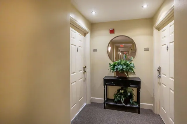 a kitchen with a sink a stove and cabinets