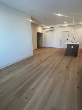 an empty room with wooden floor