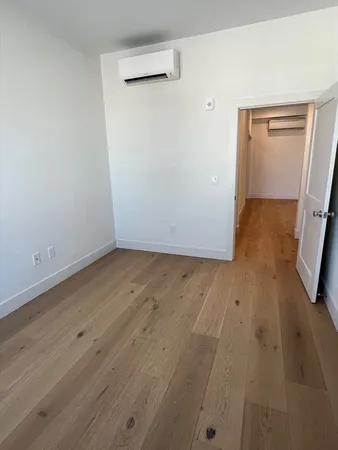 wooden floor in a white room