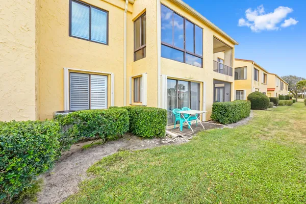 a view of a building with a yard