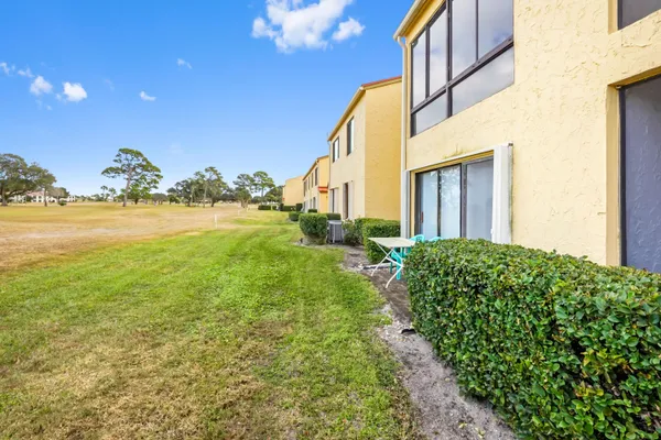 a view of a back yard of the house