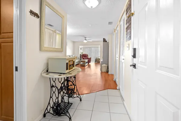 a view of a livingroom with furniture and white walls